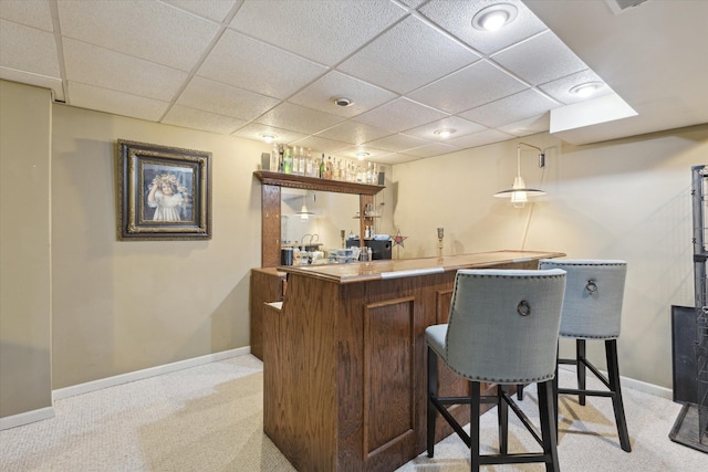 bar with light carpet and a drop ceiling