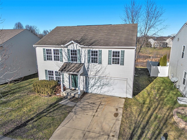 view of front of home featuring a garage and a front lawn