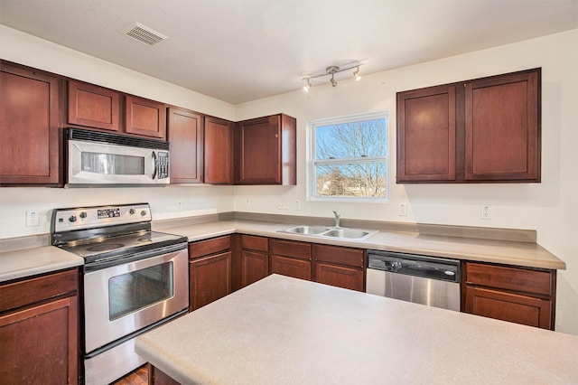 kitchen featuring appliances with stainless steel finishes and sink