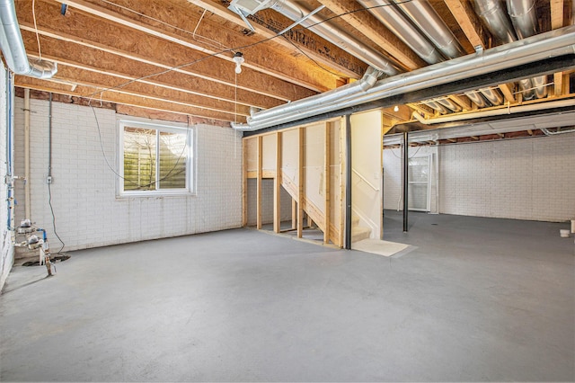 basement with brick wall