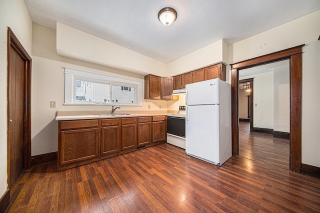 kitchen featuring sink, dark wood-type flooring, white appliances, and ventilation hood