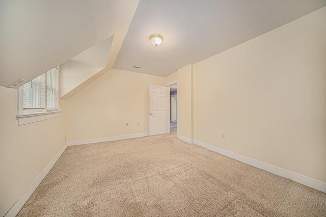 bonus room featuring carpet flooring and lofted ceiling