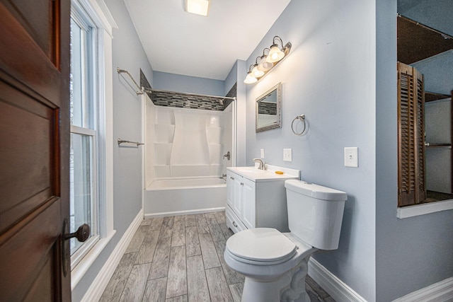 full bathroom with shower / bath combination, vanity, wood-type flooring, and toilet