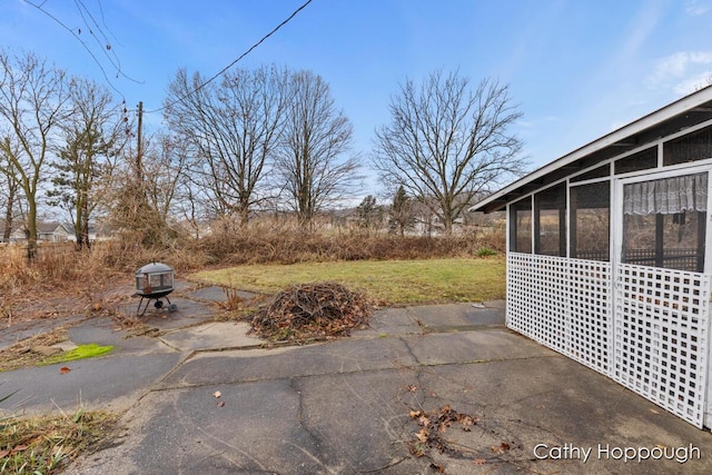 view of patio with a sunroom