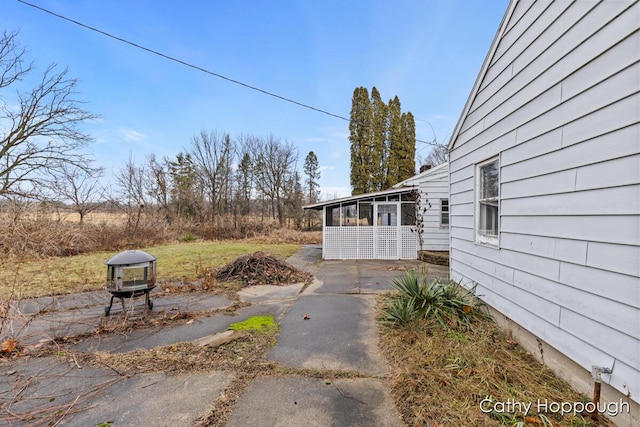 view of yard with a sunroom