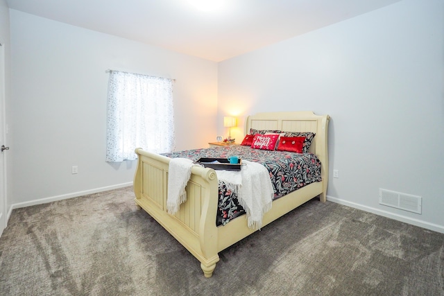 bedroom featuring dark colored carpet