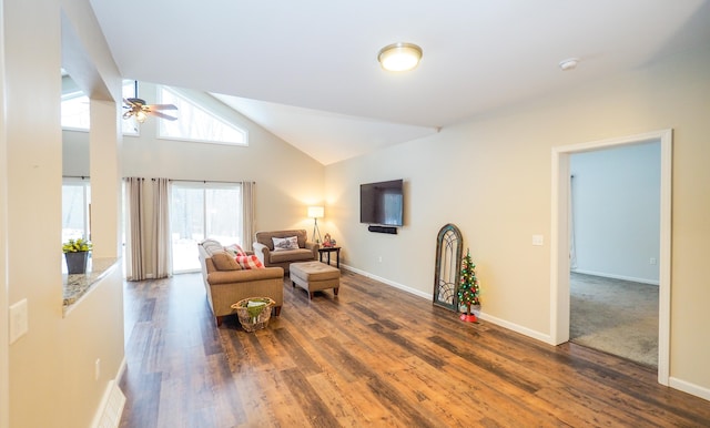 living room featuring ceiling fan, lofted ceiling, and dark wood-type flooring