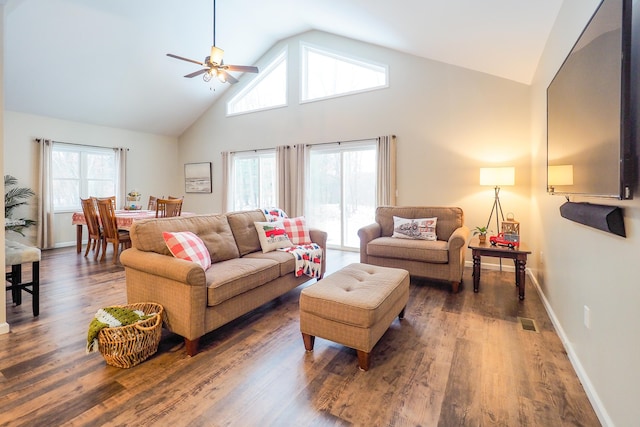 living room with ceiling fan, dark wood-type flooring, and vaulted ceiling