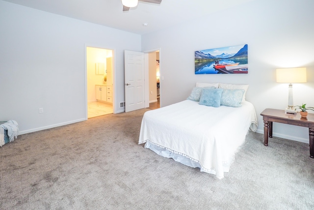 bedroom featuring connected bathroom, ceiling fan, and carpet