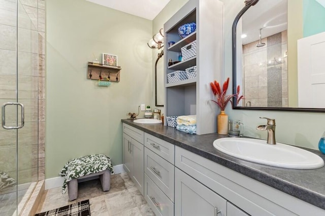 bathroom featuring vanity and an enclosed shower