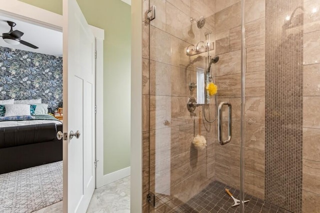 bathroom with ceiling fan and walk in shower