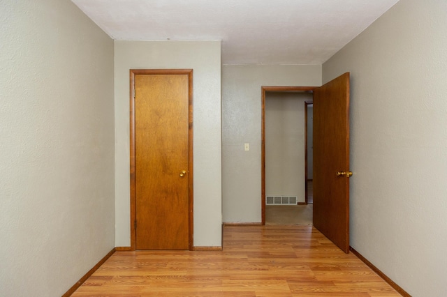 unfurnished bedroom featuring light hardwood / wood-style floors