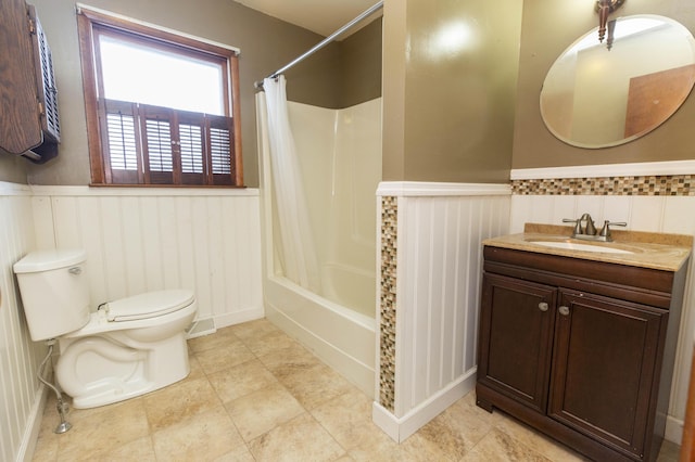 full bathroom featuring vanity, shower / tub combo, and toilet