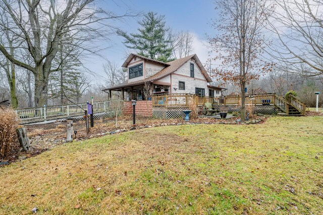 exterior space with a wooden deck and a yard