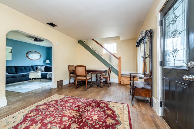 entrance foyer with ceiling fan and wood-type flooring