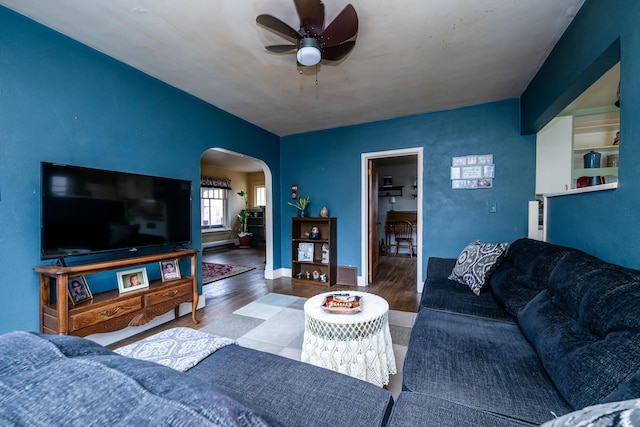 living room featuring hardwood / wood-style flooring and ceiling fan