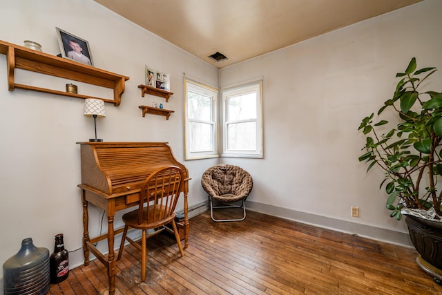 sitting room with dark wood-type flooring