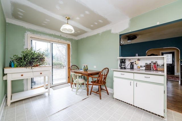 kitchen with white cabinets and pendant lighting