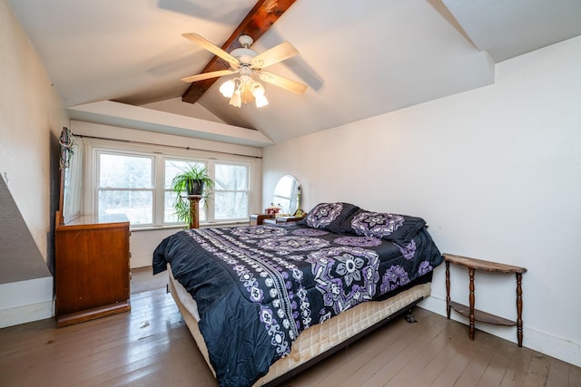 bedroom with vaulted ceiling with beams, ceiling fan, and hardwood / wood-style floors