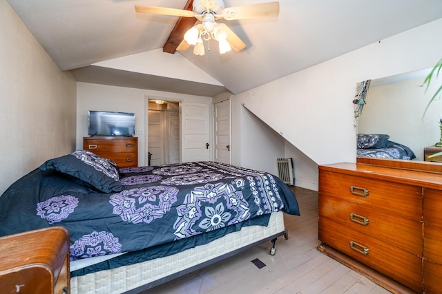 bedroom with vaulted ceiling with beams, ceiling fan, and radiator heating unit