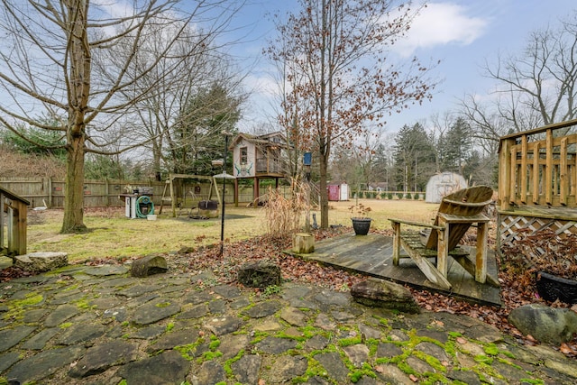 view of yard with a shed and a deck