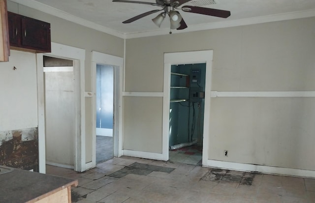 interior space with crown molding and ceiling fan