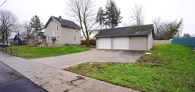 view of property exterior with a garage, an outbuilding, and a lawn