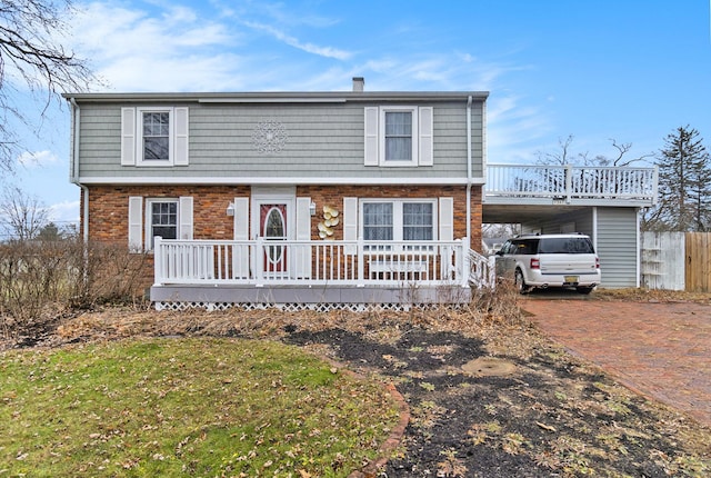 view of front of home with a carport