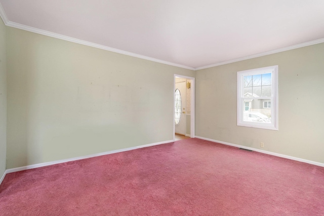 carpeted spare room featuring ornamental molding