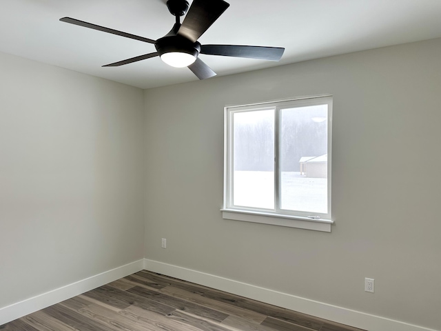 empty room featuring hardwood / wood-style flooring and ceiling fan