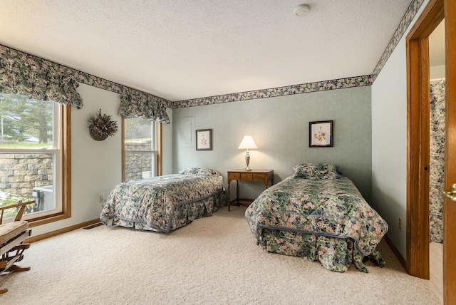 carpeted bedroom with a textured ceiling