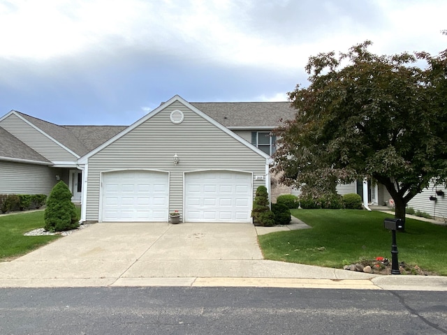 2929 Hunters Pl, Kalamazoo, MI 49048 - view of front of property with an attached garage, driveway, and a front yard