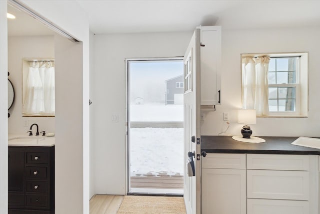 bathroom with vanity and hardwood / wood-style flooring