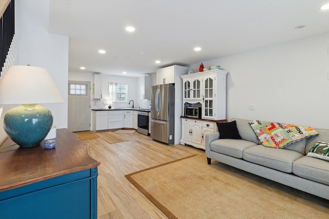 10606 Lake St, Chippewa Lake, MI 49320 - living area featuring light wood finished floors and recessed lighting