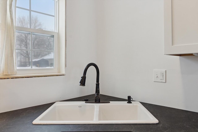 details featuring sink and white cabinets