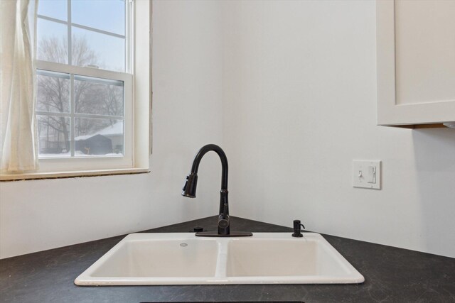 10606 Lake St, Chippewa Lake, MI 49320 - kitchen view of white cabinetry and dark countertops