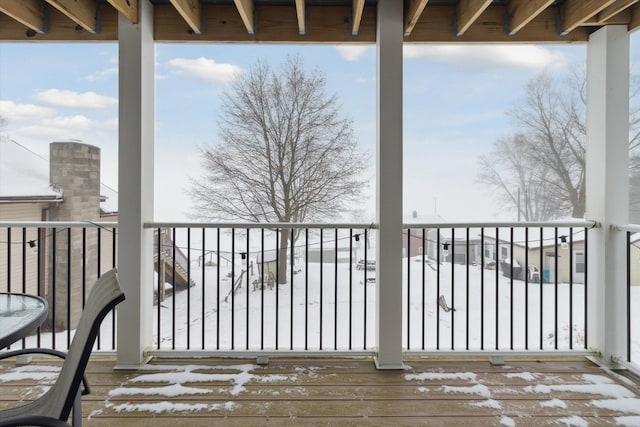 view of snow covered deck