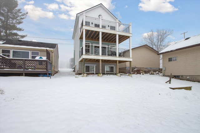 snow covered house with a balcony