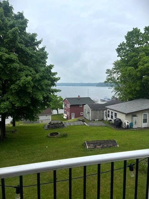 10606 Lake St, Chippewa Lake, MI 49320 - view of front of house with a water view and a front yard