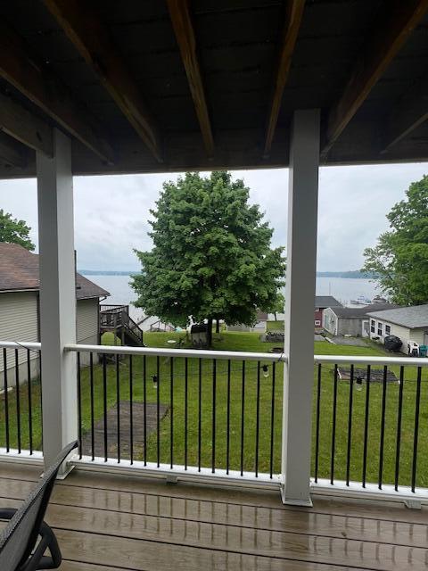 10606 Lake St, Chippewa Lake, MI 49320 - deck featuring a lawn and a residential view