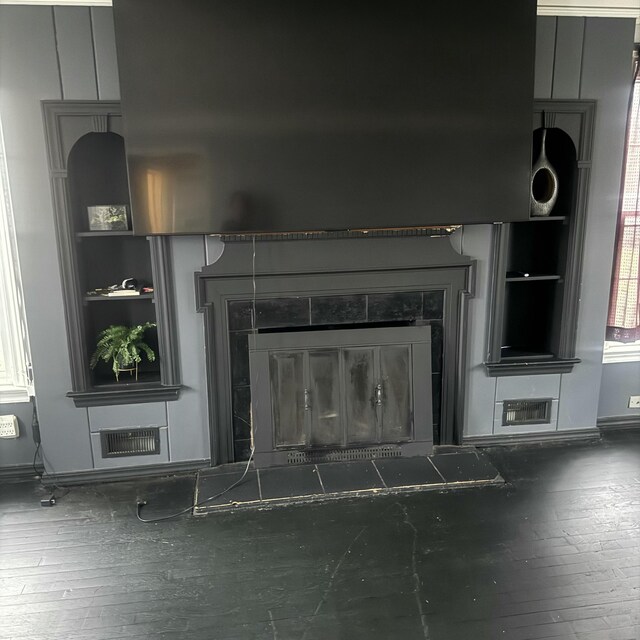 interior details with a fireplace and hardwood / wood-style flooring