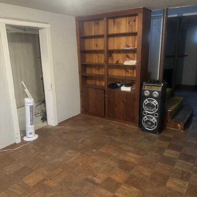 interior space with dark parquet flooring