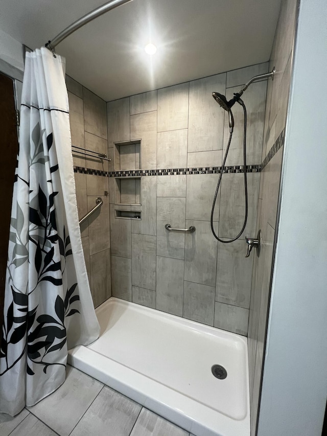 bathroom featuring tile patterned floors and walk in shower