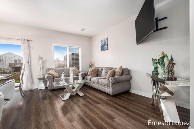 living room with dark hardwood / wood-style flooring