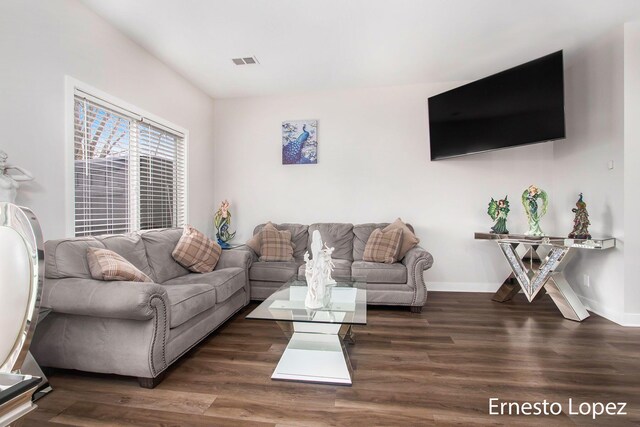 living room with dark hardwood / wood-style flooring