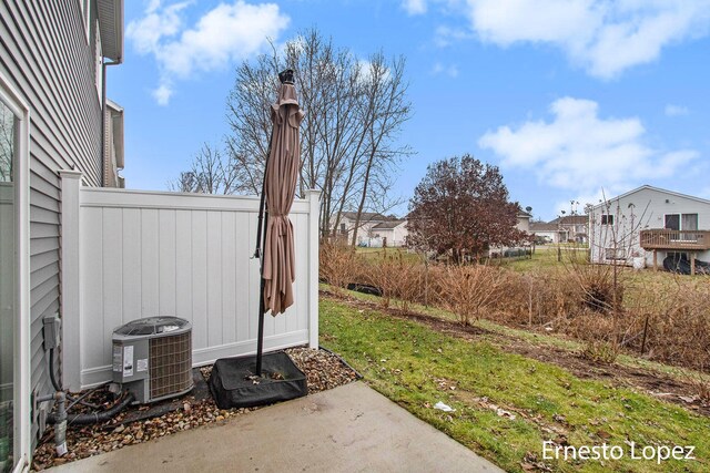 view of yard with central AC unit