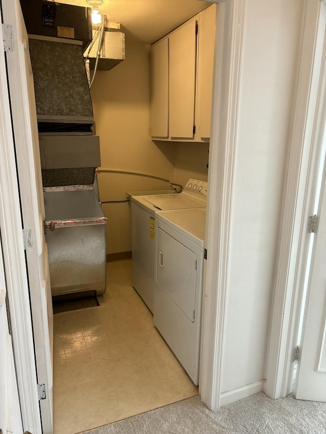 laundry area featuring cabinet space and separate washer and dryer