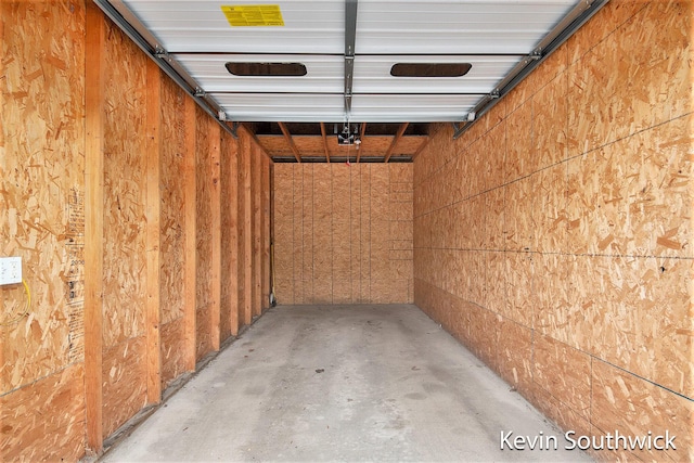 garage with wood walls