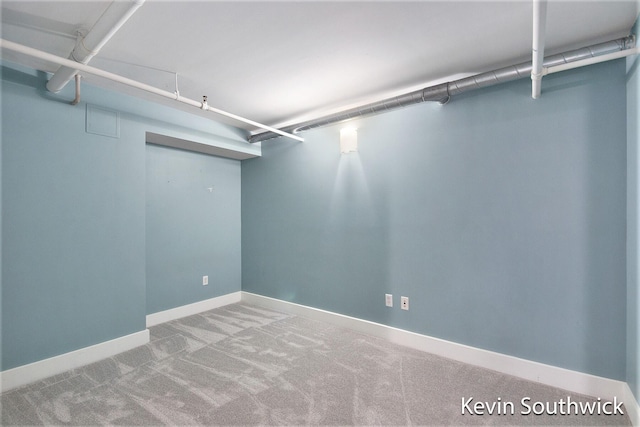 walk in closet with carpet floors