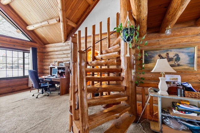 stairs featuring carpet, rustic walls, high vaulted ceiling, and beamed ceiling